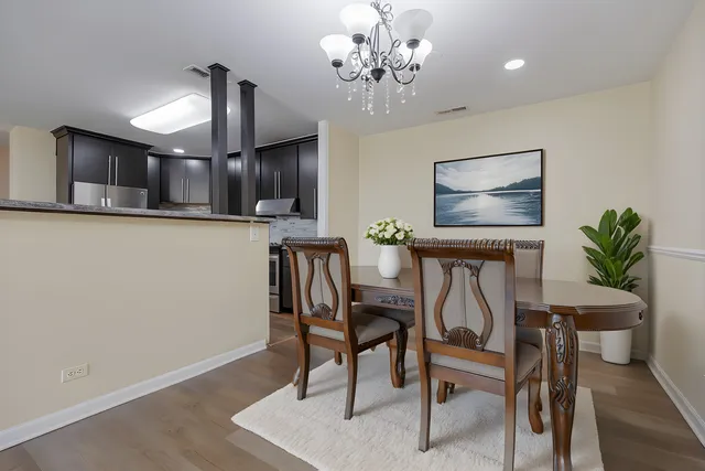 a view of a dining room with furniture and wooden floor