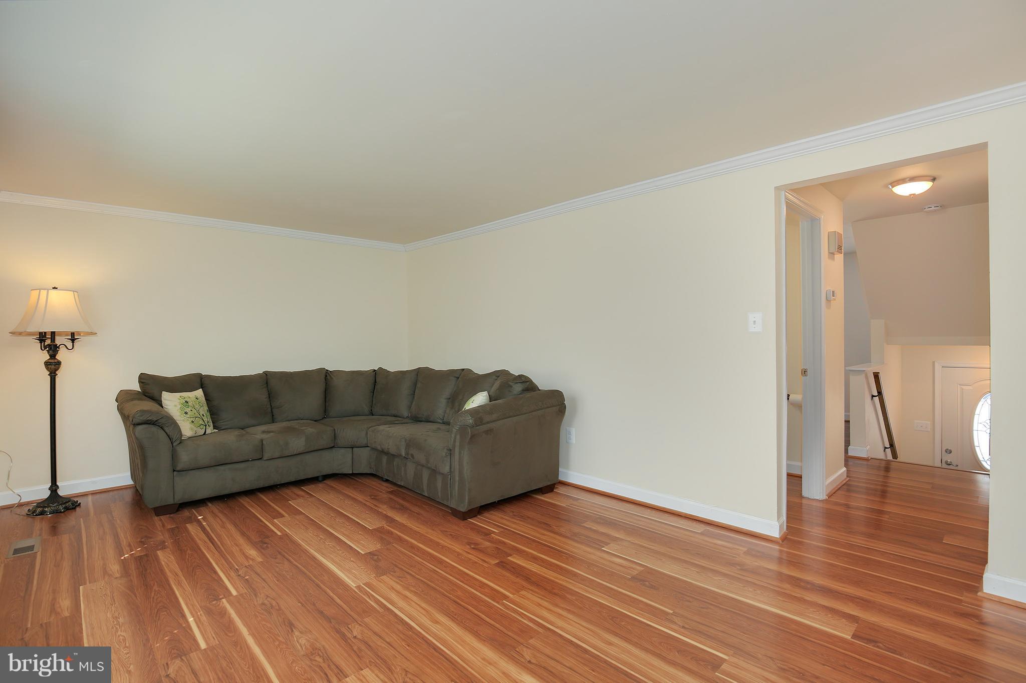 17555 Kohlhoss Road Poolesville, MD 20837 - Photo 6 of 24 a living room with furniture and a wooden floor
