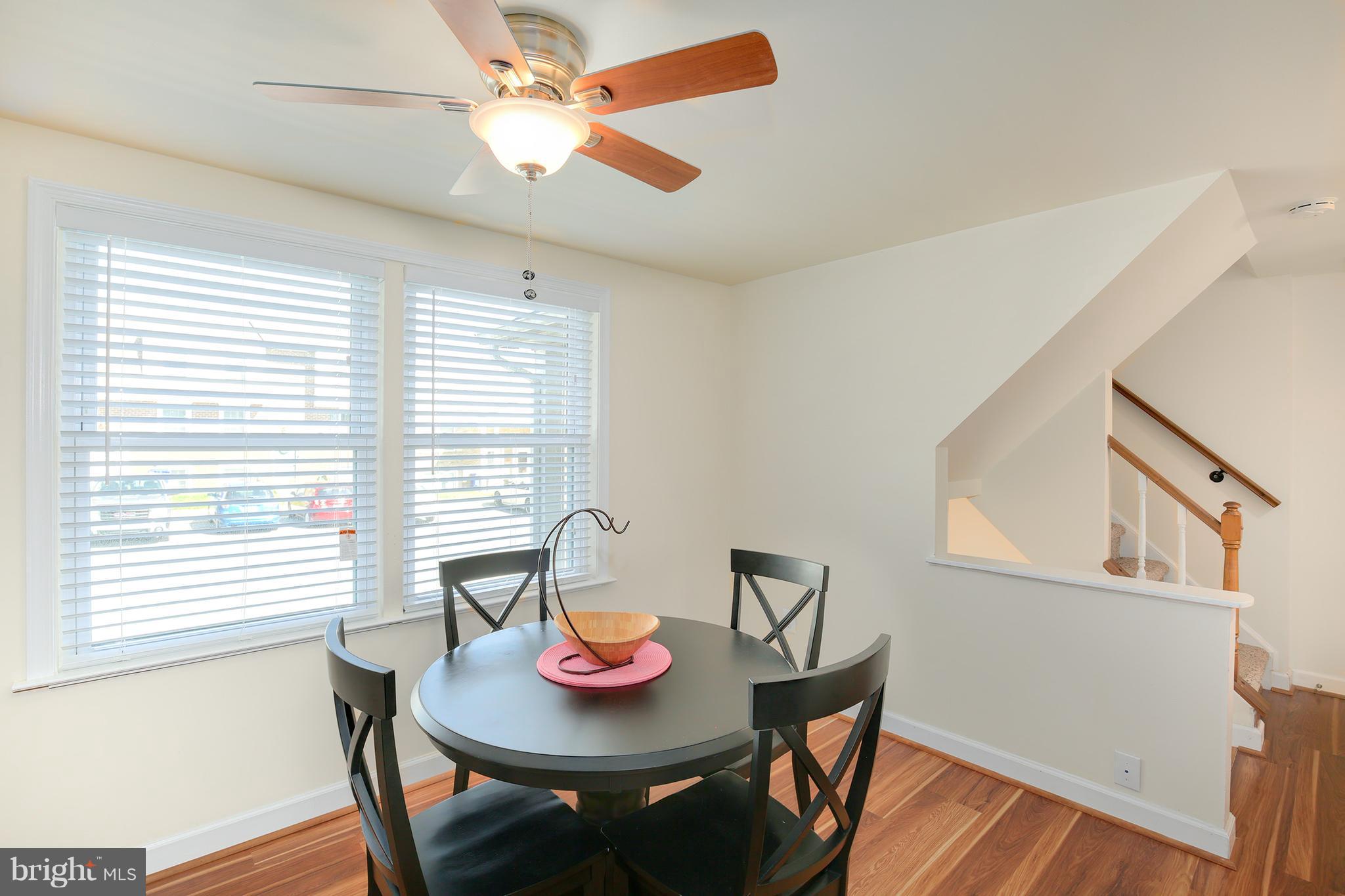 17555 Kohlhoss Road Poolesville, MD 20837 - Photo 9 of 24 a view of a dining room with furniture window and wooden floor