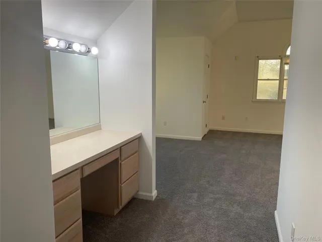 a room with windows and brick walls