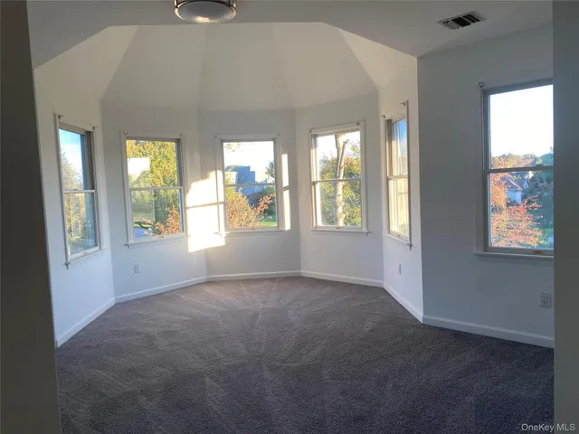 an empty room that has a window