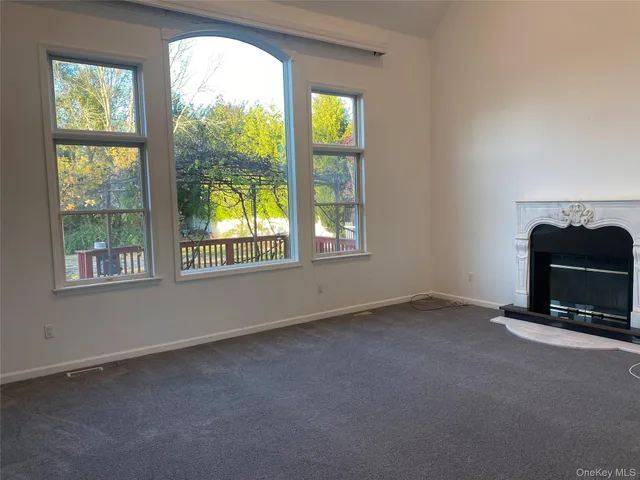 an empty room with a fireplace
