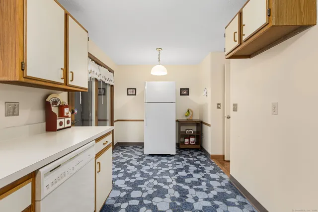 a kitchen with a sink and a refrigerator