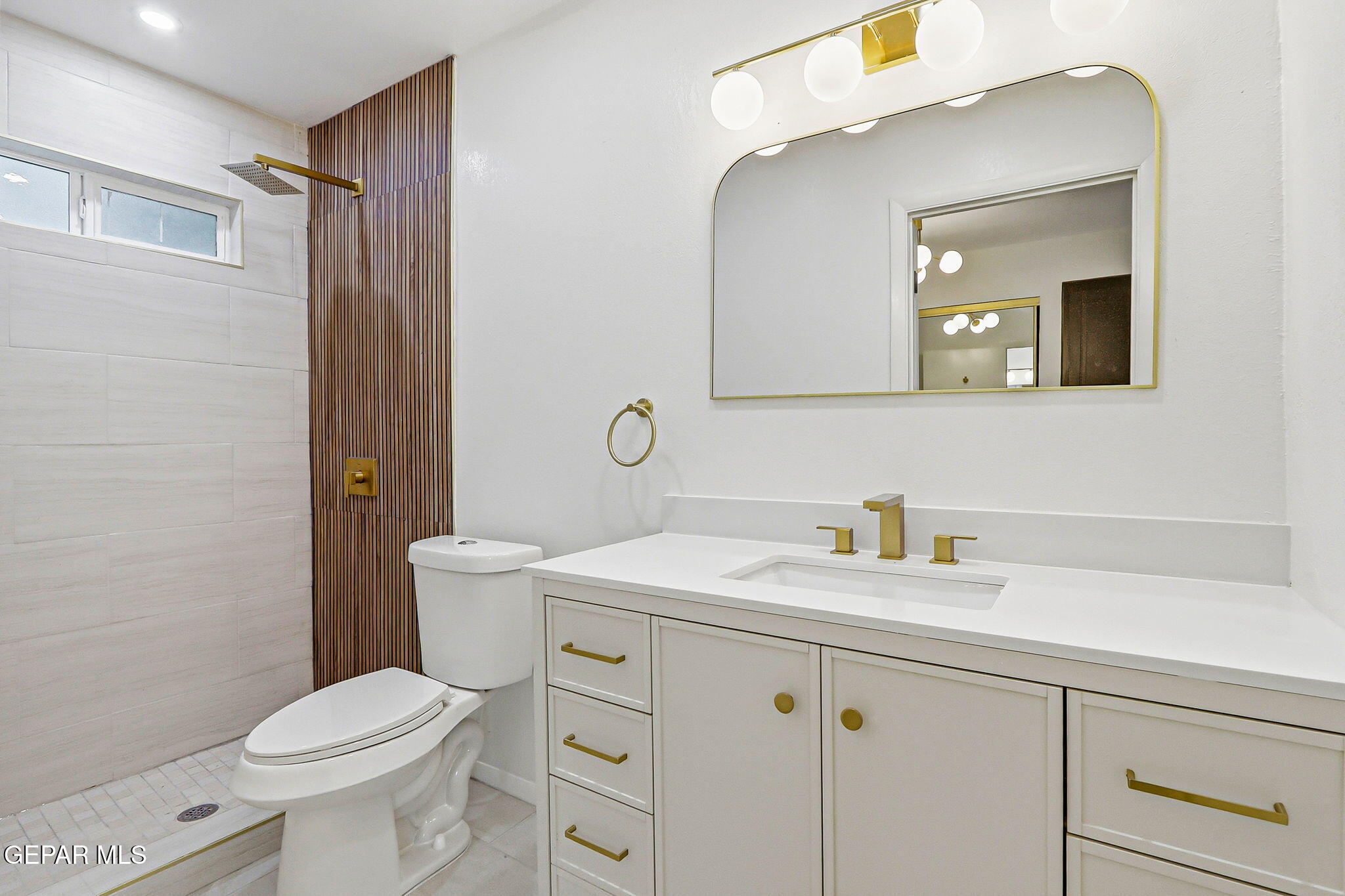 709 Frontera Road El Paso, TX 79922 - Photo 36 of 41 a bathroom with a sink a toilet and a mirror