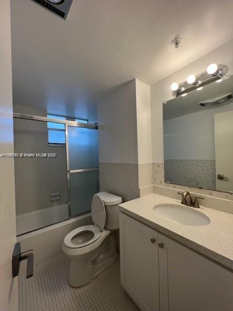 Mid Beach Miami Beach, FL 33140 - Photo 3 of 12 a bathroom with a toilet a sink and shower