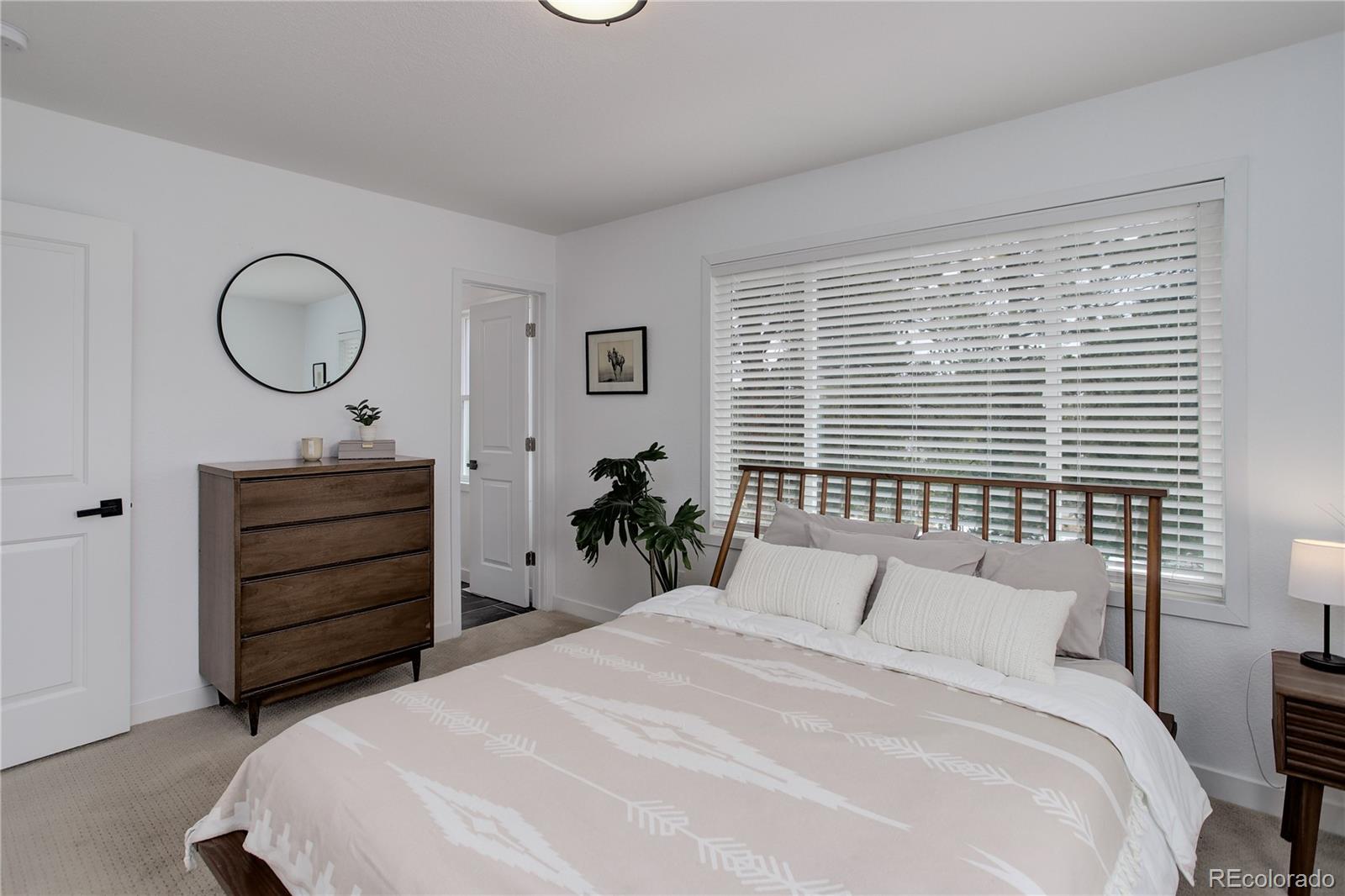 95 Fitzsimmons Road Bailey, CO 80421 - Photo 12 of 38 a bedroom with a bed and a closet