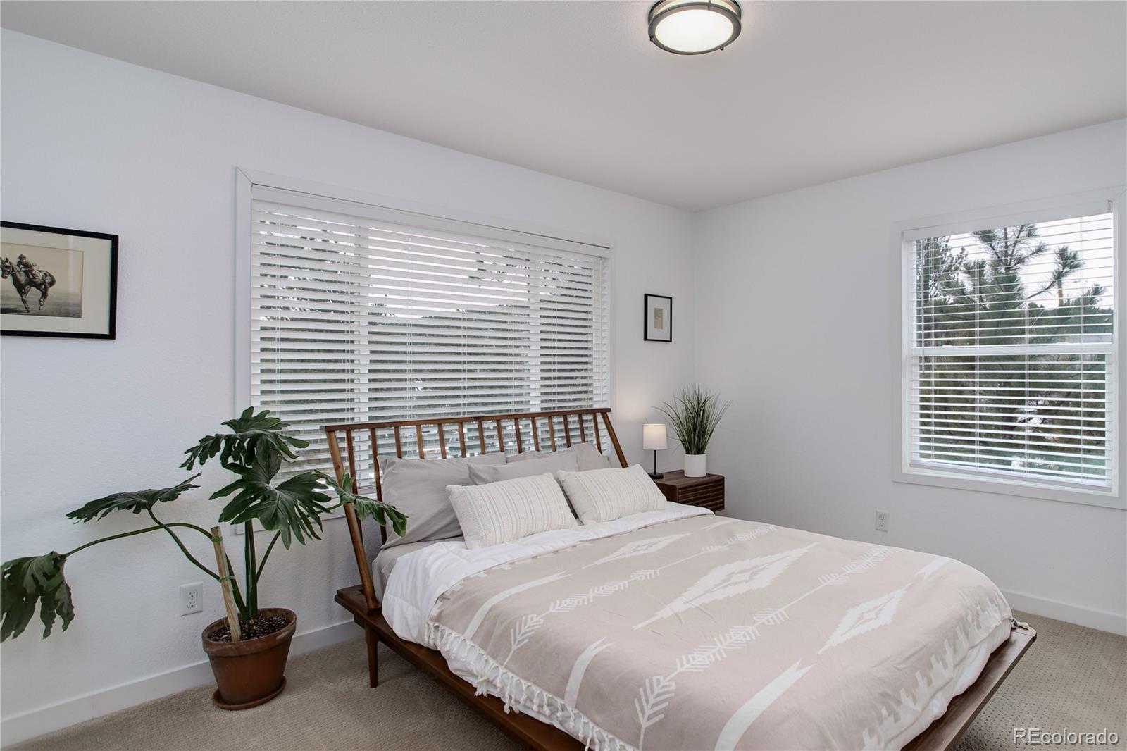 95 Fitzsimmons Road Bailey, CO 80421 - Photo 13 of 38 a bedroom with a bed and a window