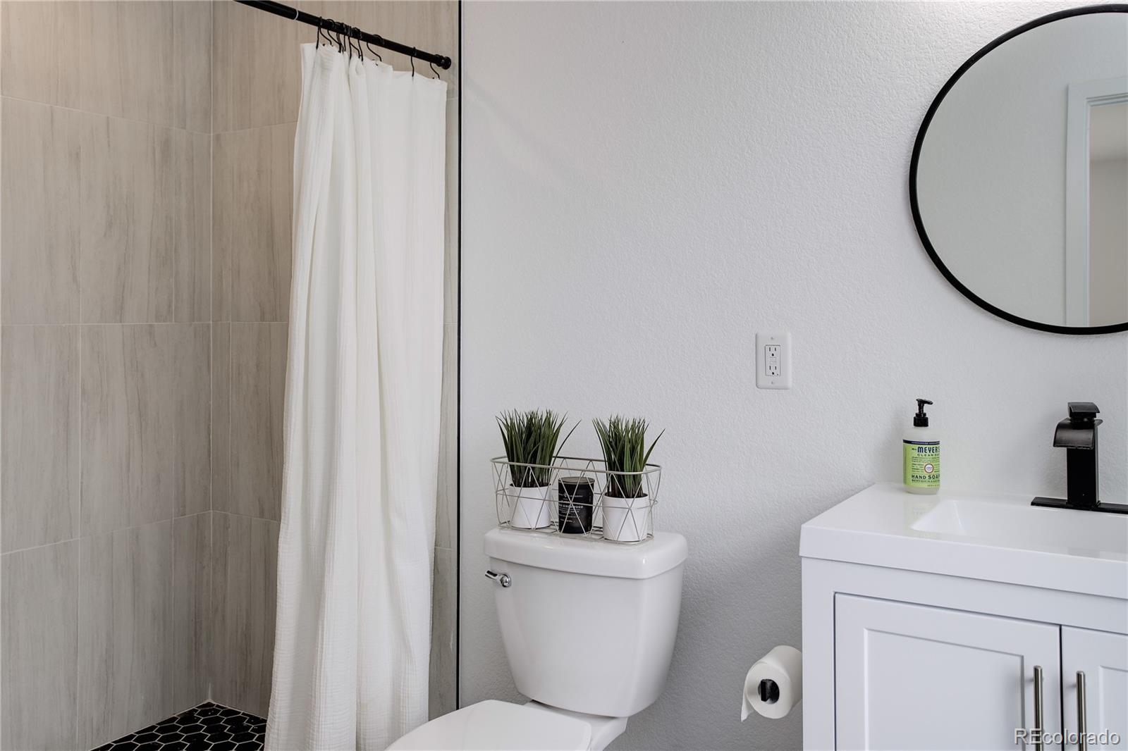 95 Fitzsimmons Road Bailey, CO 80421 - Photo 15 of 38 a bathroom with a toilet and a sink