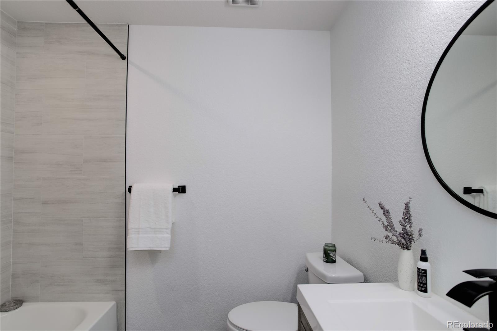 95 Fitzsimmons Road Bailey, CO 80421 - Photo 17 of 38 a bathroom with a toilet and a mirror