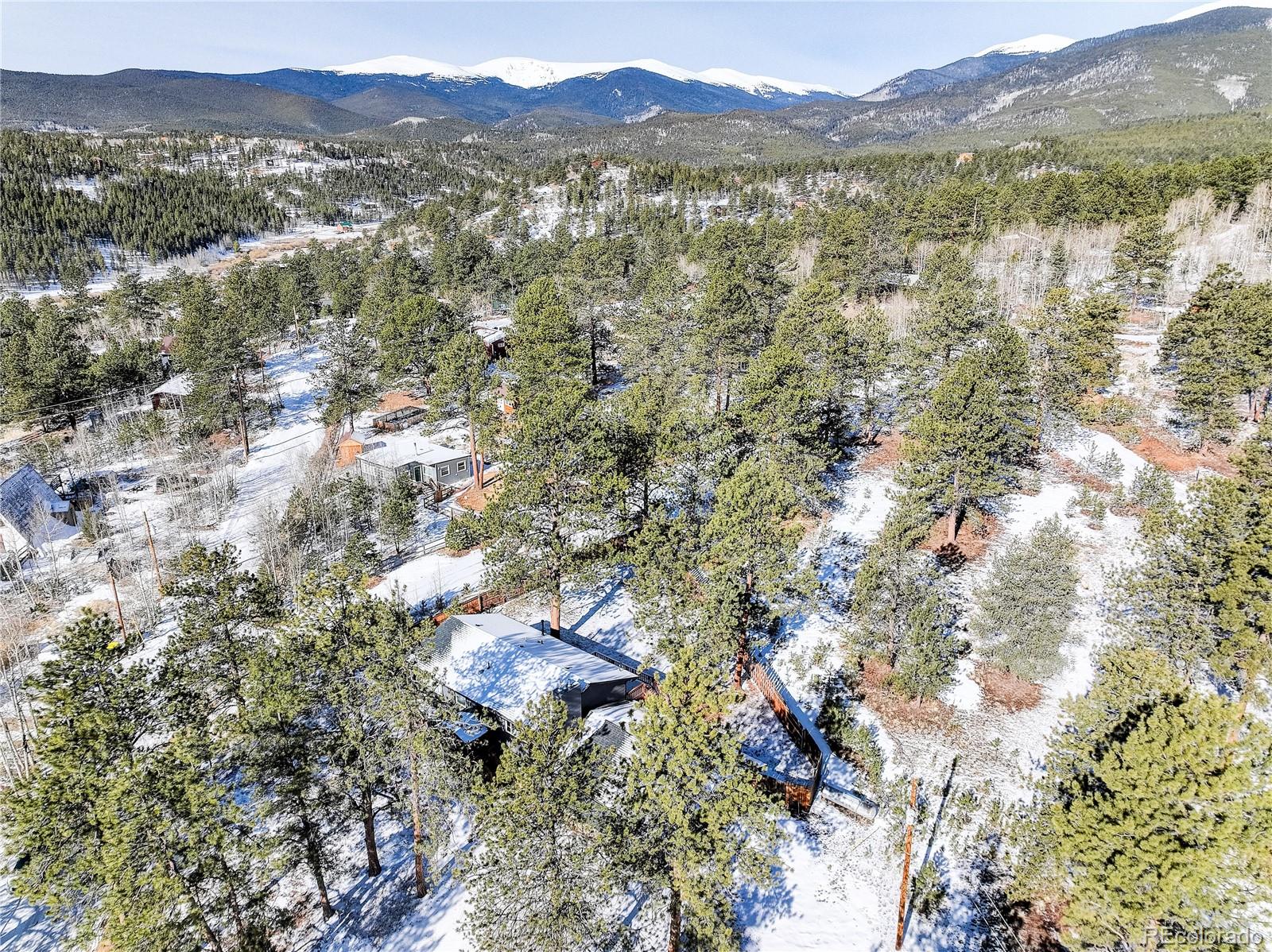 95 Fitzsimmons Road Bailey, CO 80421 - Photo 3 of 38 a view of lake with mountain