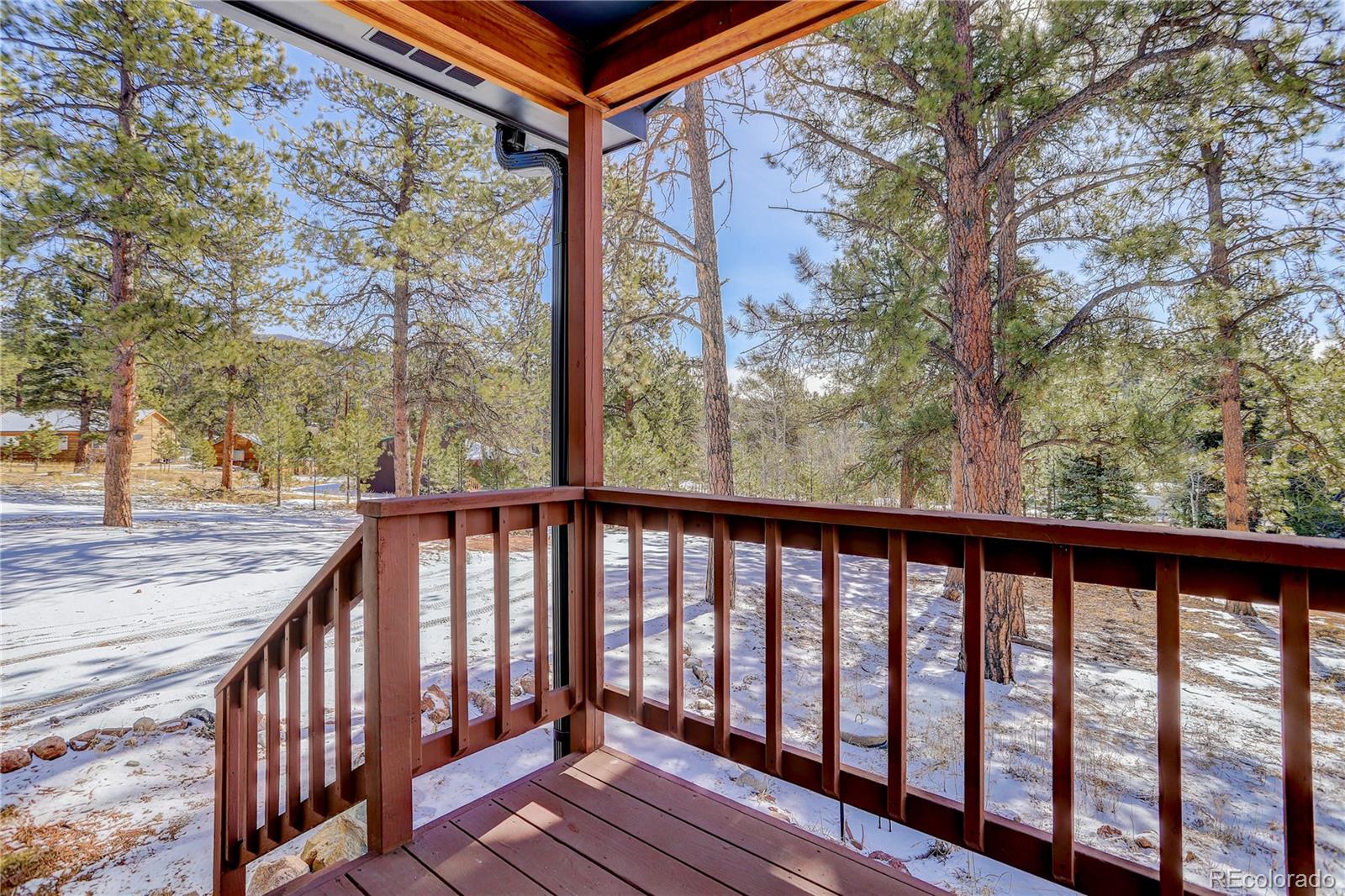 95 Fitzsimmons Road Bailey, CO 80421 - Photo 35 of 38 a view of balcony with wooden floor and fence