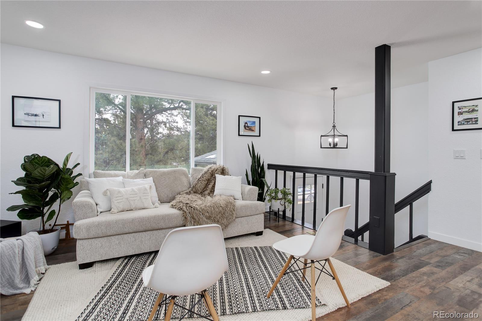 95 Fitzsimmons Road Bailey, CO 80421 - Photo 5 of 38 a living room with furniture and a large window