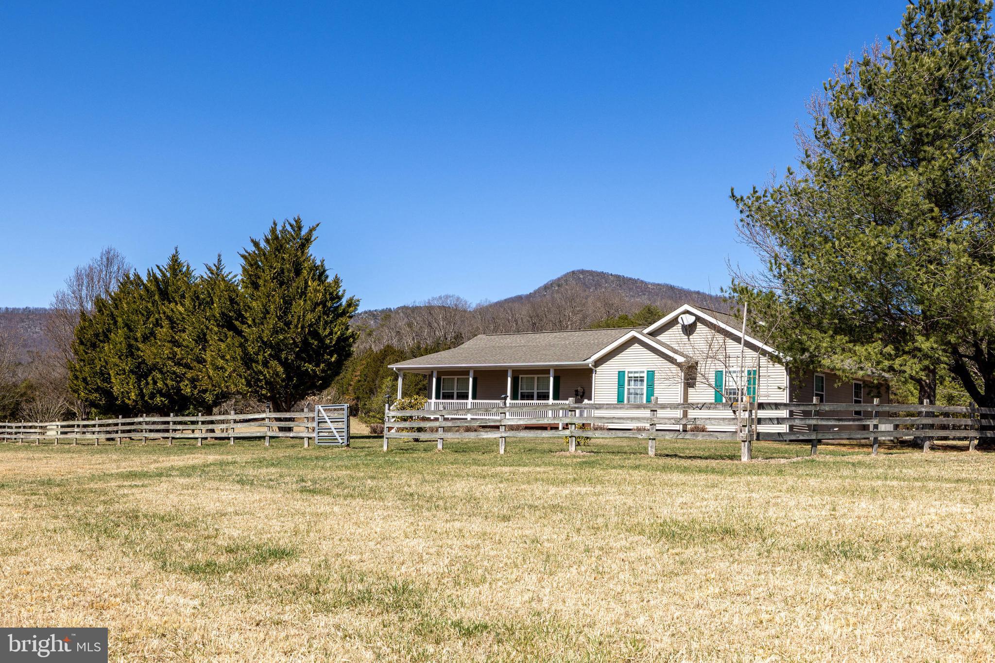 2301 South Page Valley Road Luray, VA 22835 - Photo 19 of 66 a house with swimming pool in front of it