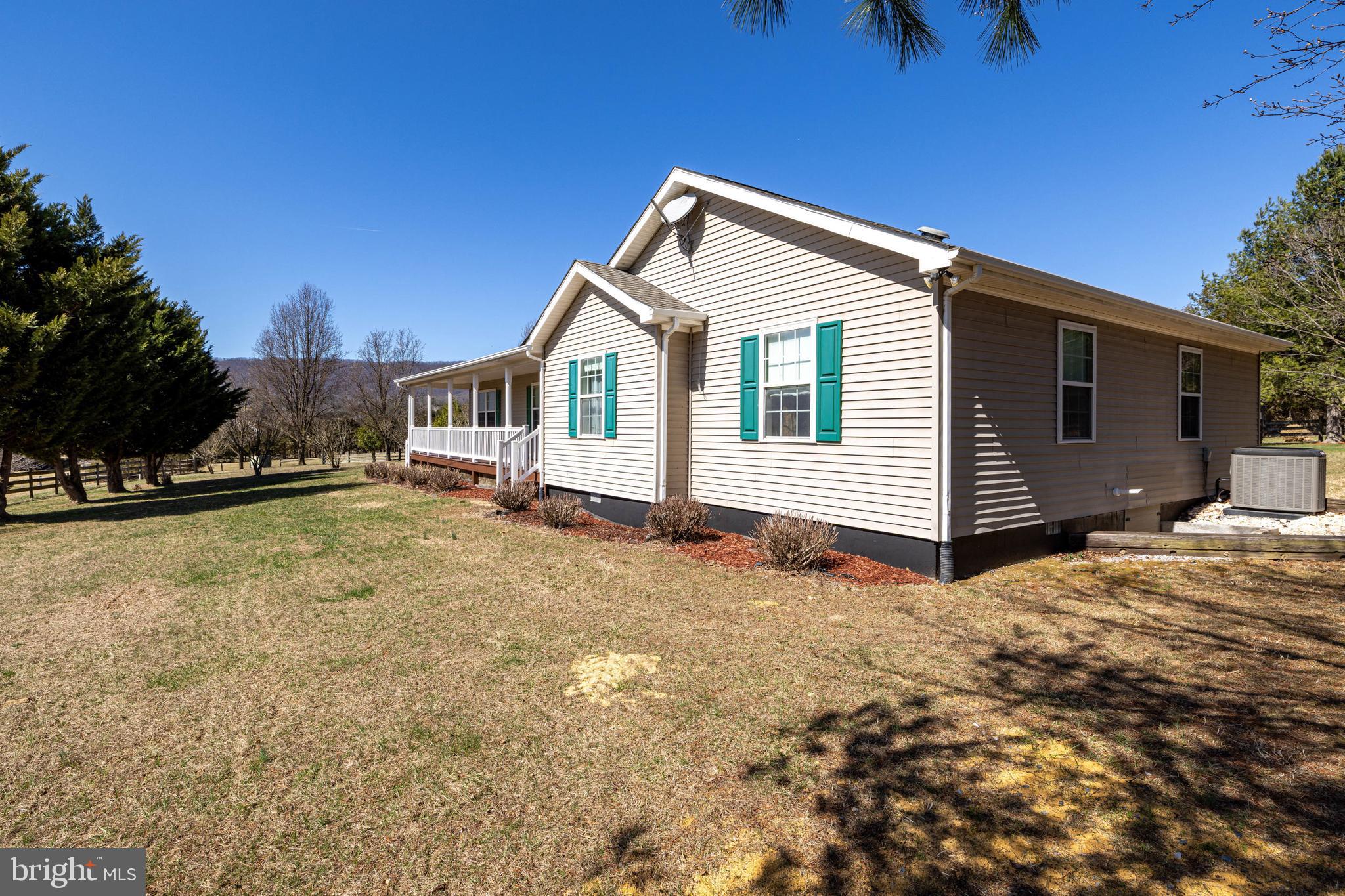 2301 South Page Valley Road Luray, VA 22835 - Photo 21 of 66 a front view of a house with a yard