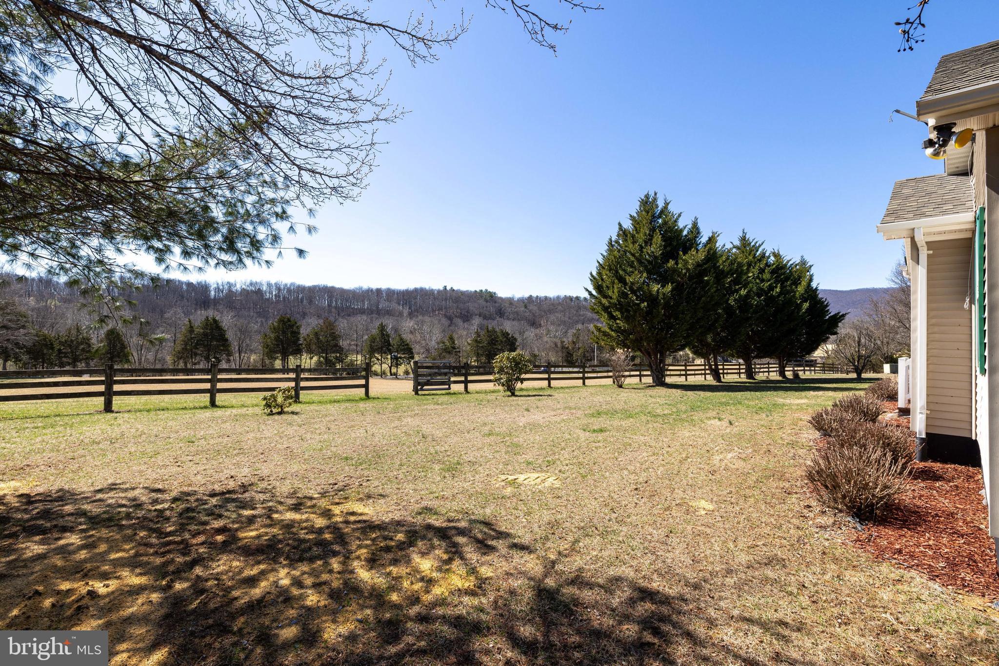 2301 South Page Valley Road Luray, VA 22835 - Photo 22 of 66 a view of a swimming pool with an outdoor seating and a yard