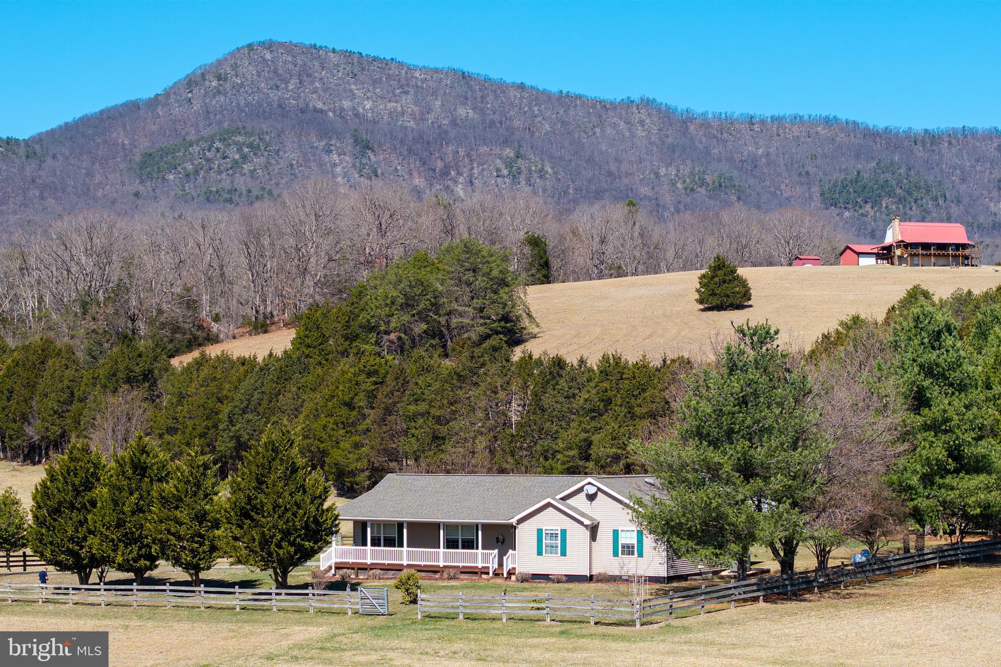 2301 South Page Valley Road Luray, VA 22835 - Photo 3 of 66 a view of a house with a yard and a large window