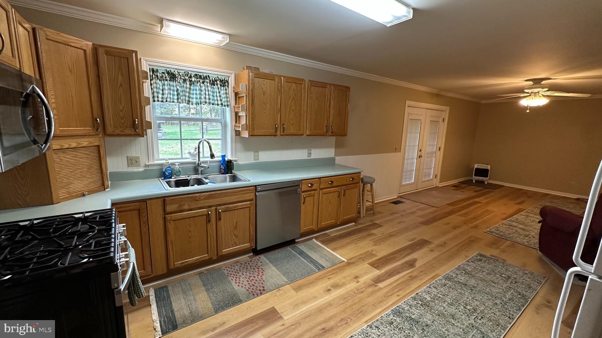 2301 South Page Valley Road Luray, VA 22835 - Photo 37 of 66 a kitchen with stainless steel appliances granite countertop a sink stove and refrigerator