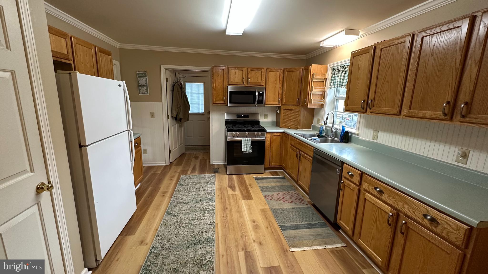 2301 South Page Valley Road Luray, VA 22835 - Photo 39 of 66 a kitchen with stainless steel appliances a refrigerator and a sink