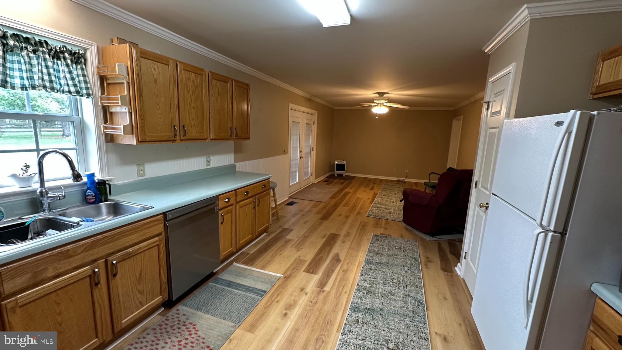2301 South Page Valley Road Luray, VA 22835 - Photo 40 of 66 a kitchen with kitchen island a counter top space a sink stainless steel appliances and cabinets