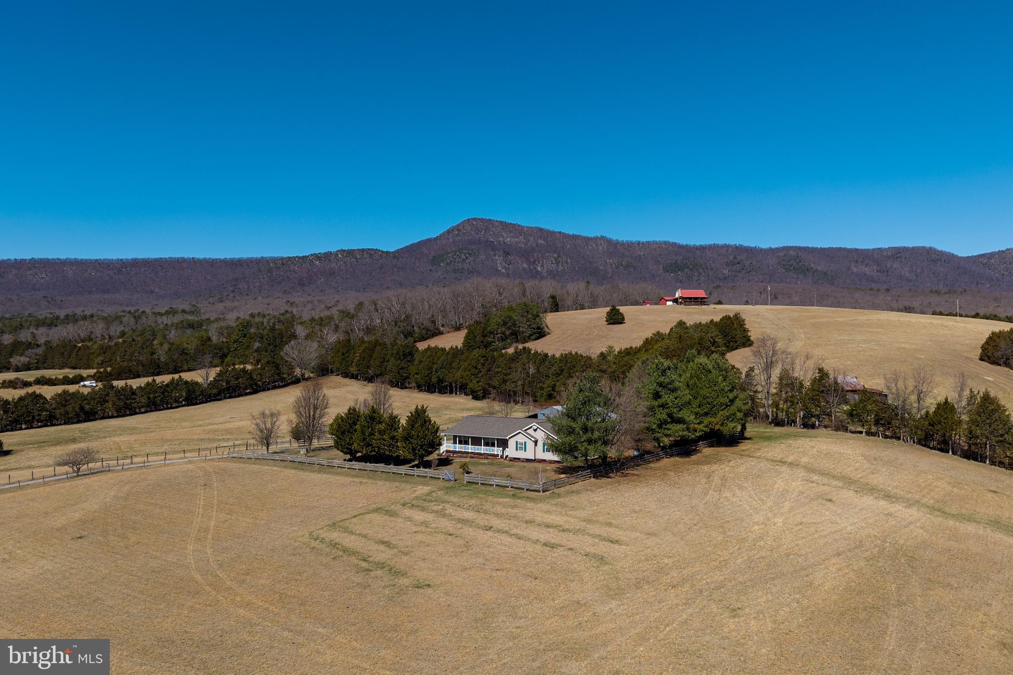2301 South Page Valley Road Luray, VA 22835 - Photo 4 of 66 a view of a street with a mountain in the background