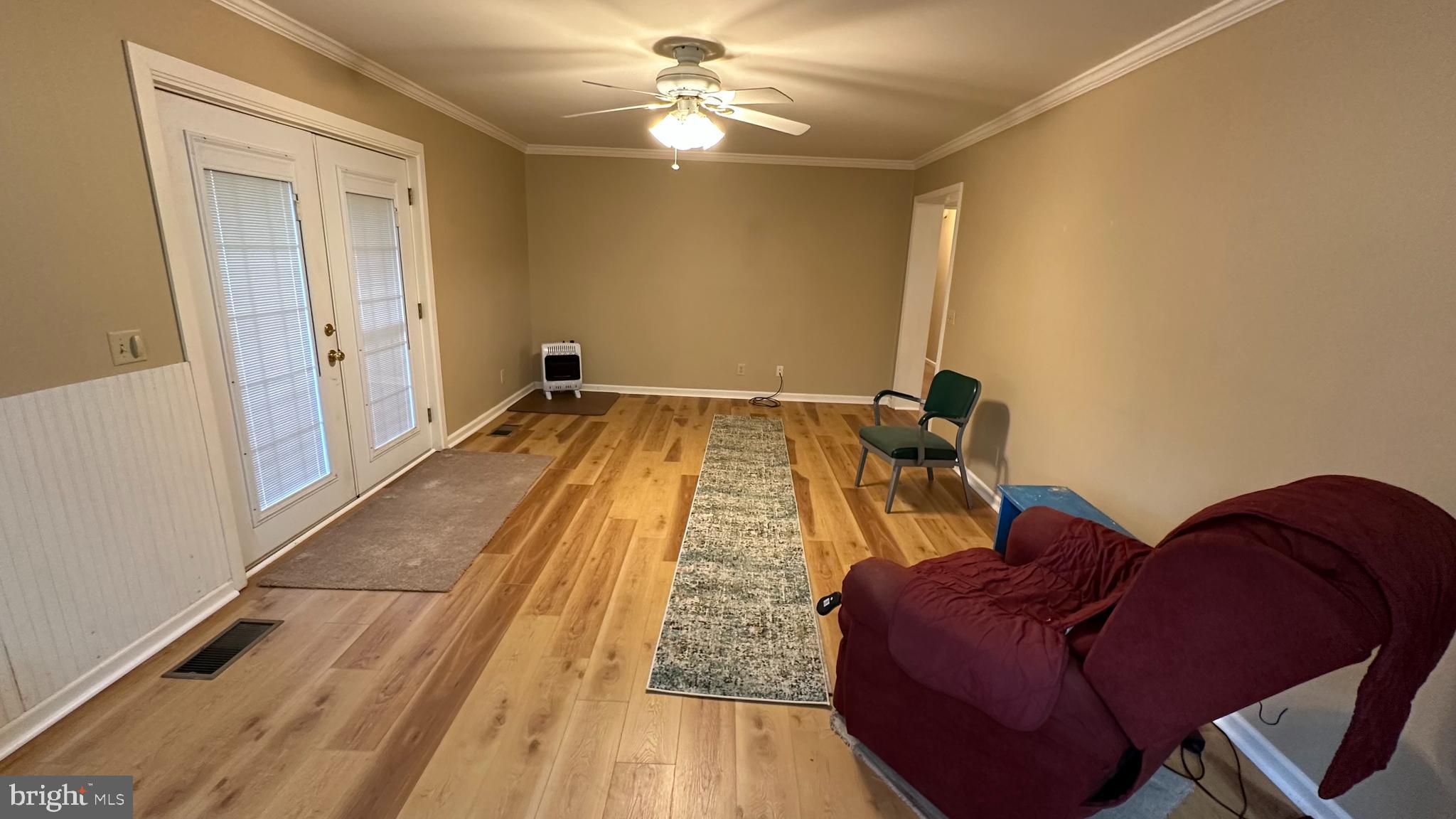 2301 South Page Valley Road Luray, VA 22835 - Photo 41 of 66 a bed room with a bed and a chandelier