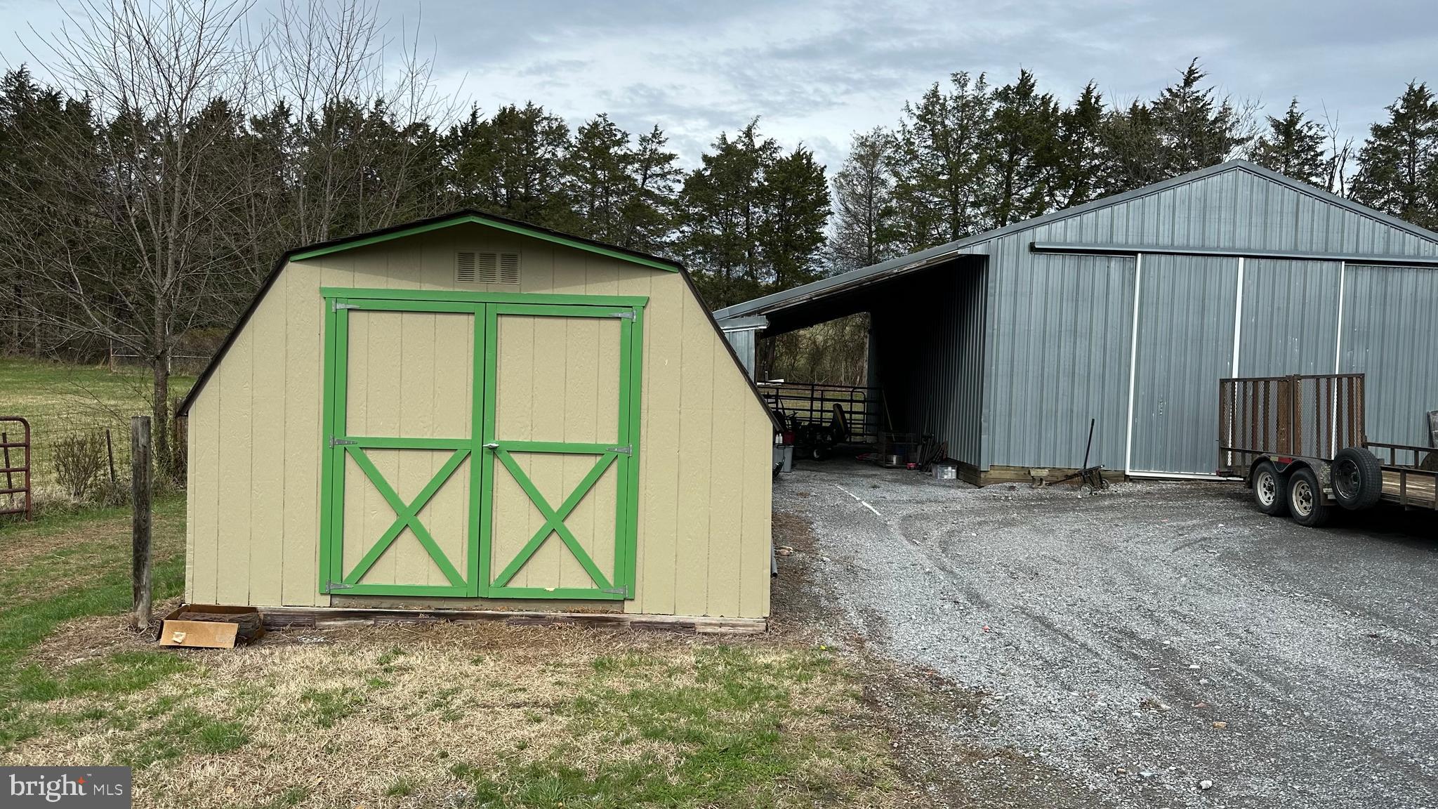 2301 South Page Valley Road Luray, VA 22835 - Photo 65 of 66 a view of a garage with a sink and a yard