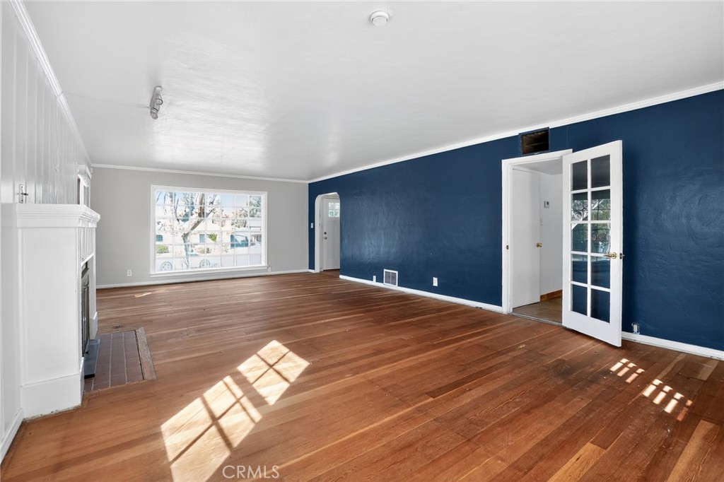 1717 Locust Ravine Bakersfield, CA 93306 - Photo 11 of 29 a view of a livingroom with wooden floor and a window