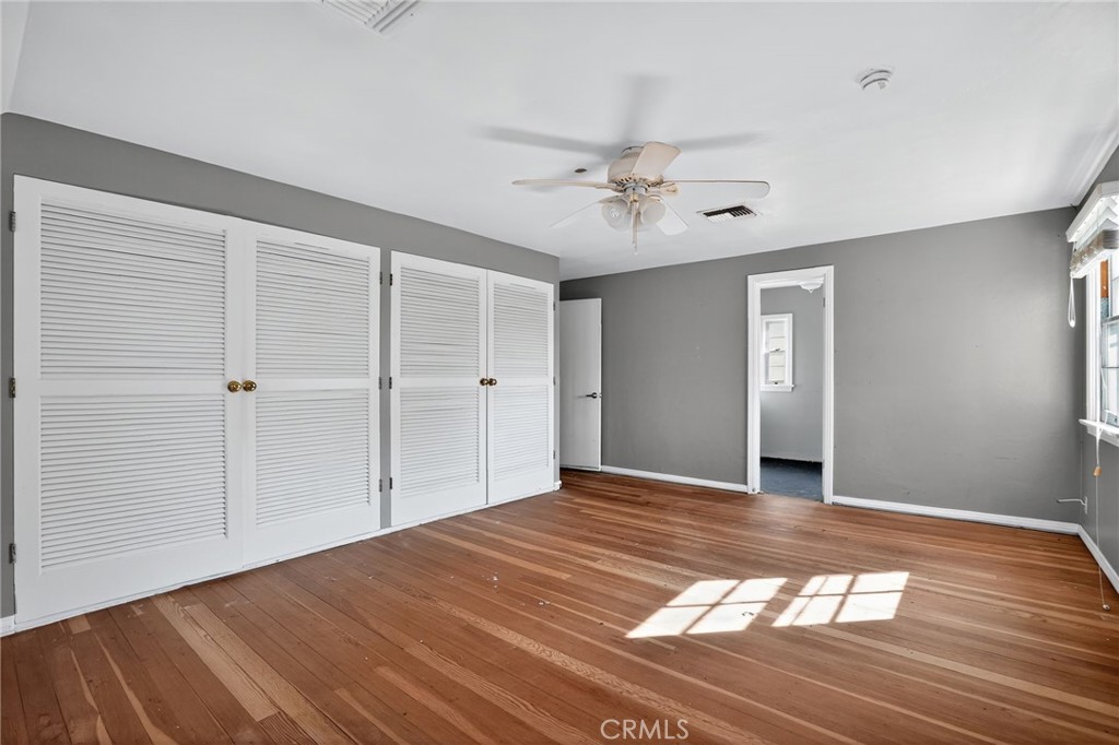 1717 Locust Ravine Bakersfield, CA 93306 - Photo 15 of 29 a view of empty room with window and wooden floor
