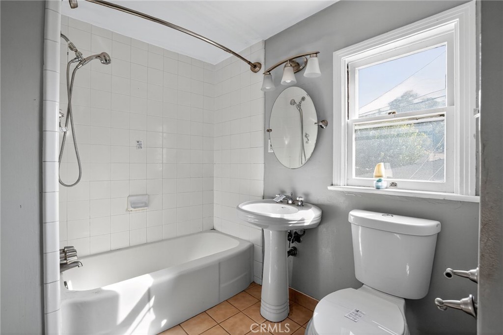 1717 Locust Ravine Bakersfield, CA 93306 - Photo 17 of 29 a bathroom with a sink a toilet and a shower