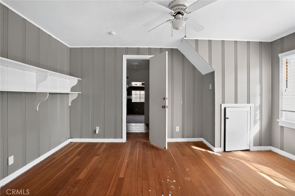 1717 Locust Ravine Bakersfield, CA 93306 - Photo 26 of 29 a view of a livingroom with wooden floor and staircase