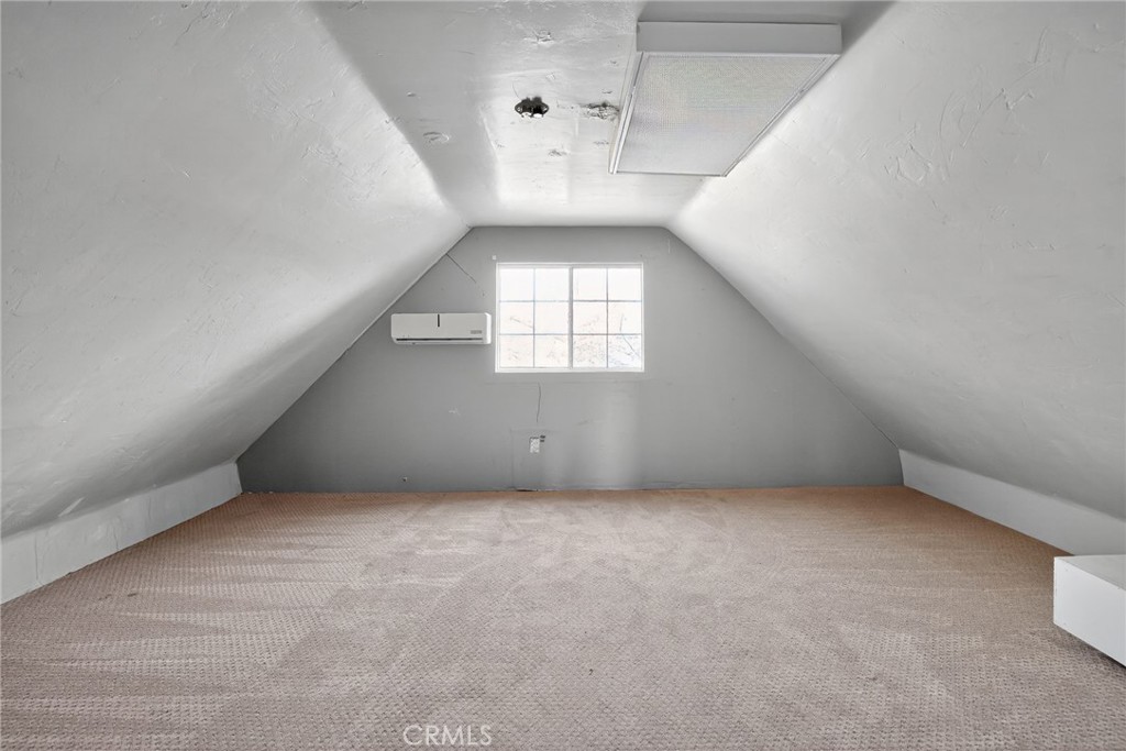 1717 Locust Ravine Bakersfield, CA 93306 - Photo 28 of 29 an empty room with windows and entrance