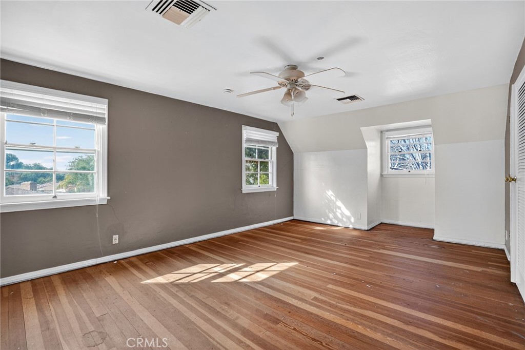 1717 Locust Ravine Bakersfield, CA 93306 - Photo 29 of 29 a view of empty room with wooden floor and fan