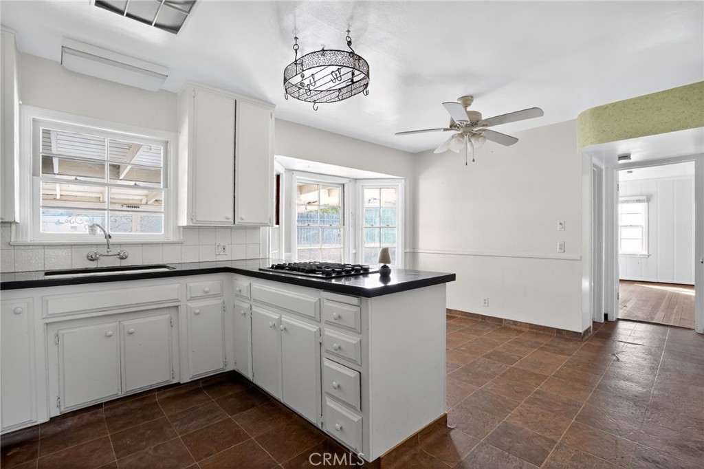 1717 Locust Ravine Bakersfield, CA 93306 - Photo 10 of 29 a kitchen with granite countertop a sink stainless steel appliances and cabinets