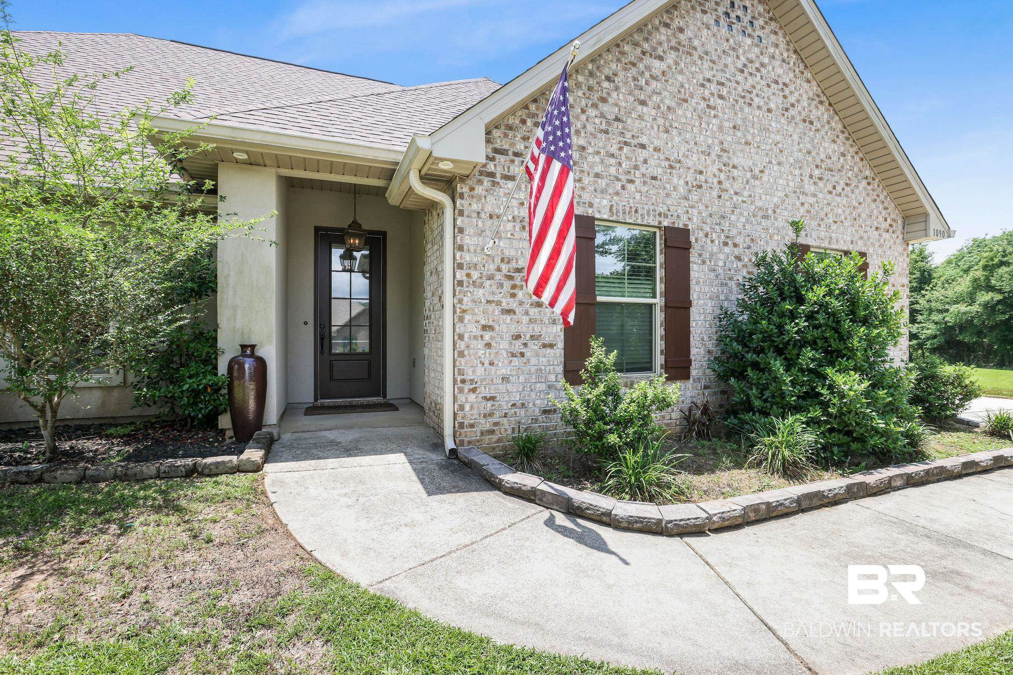 1090 Destin Avenue Foley, AL 36535 - Photo 3 of 30 Property entrance featuring brick siding and roof with shingles