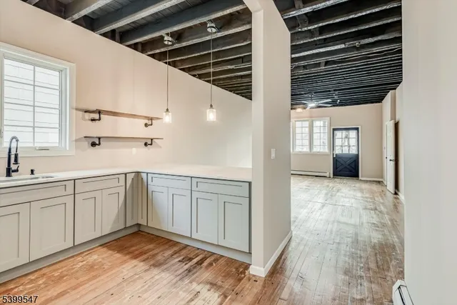 a kitchen with a cabinets and chandelier
