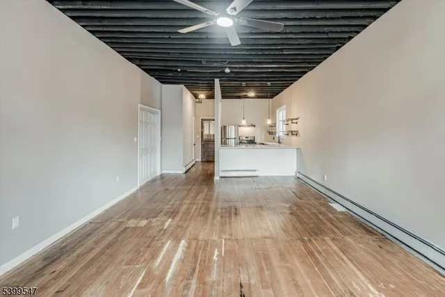 a view of a livingroom with wooden floor