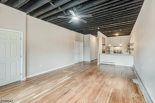 a view of hallway with wooden floor