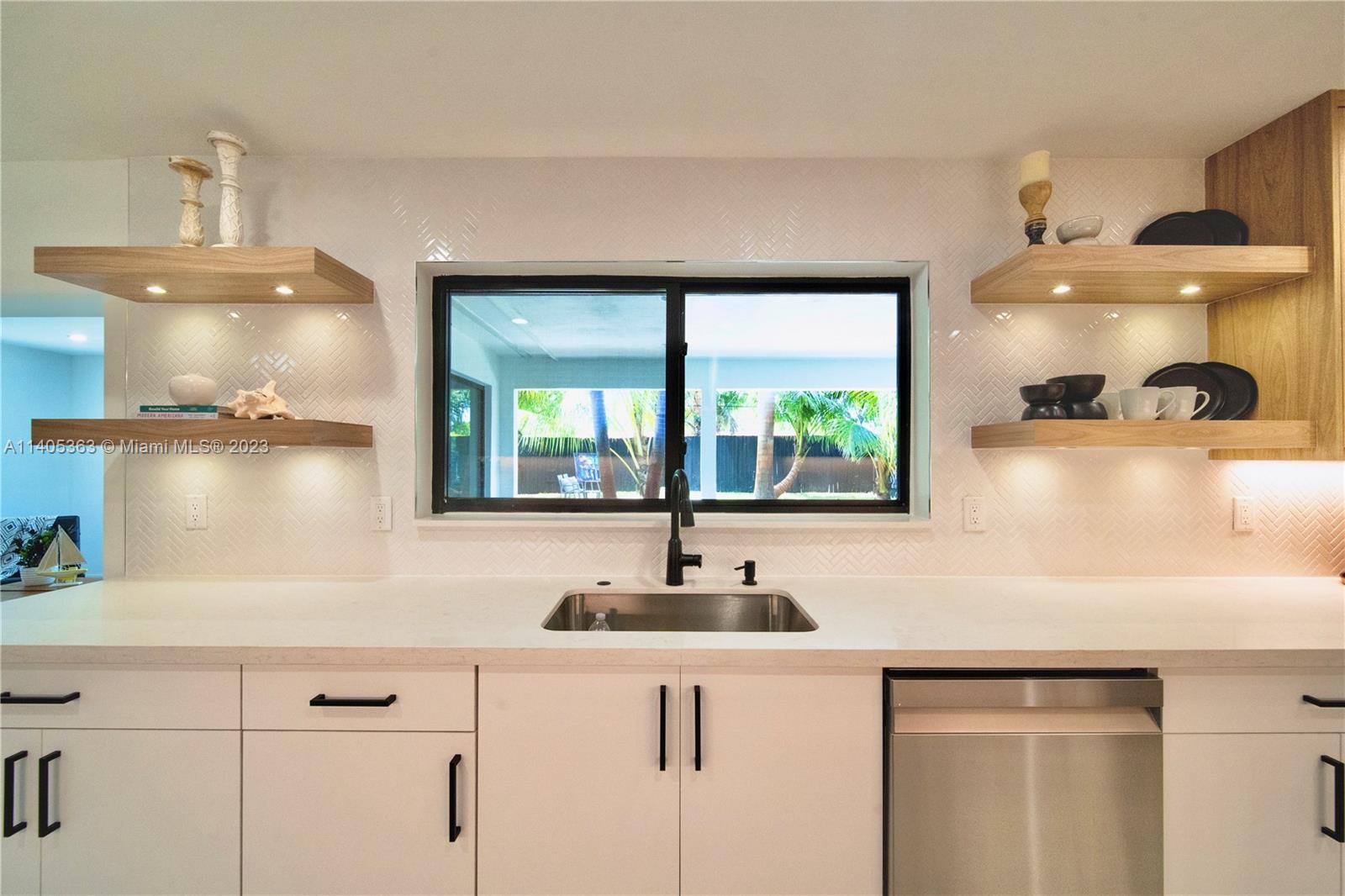 1201 Northwest 3rd Avenue Boca Raton, FL 33432 - Photo 6 of 29 a kitchen with a sink and a window