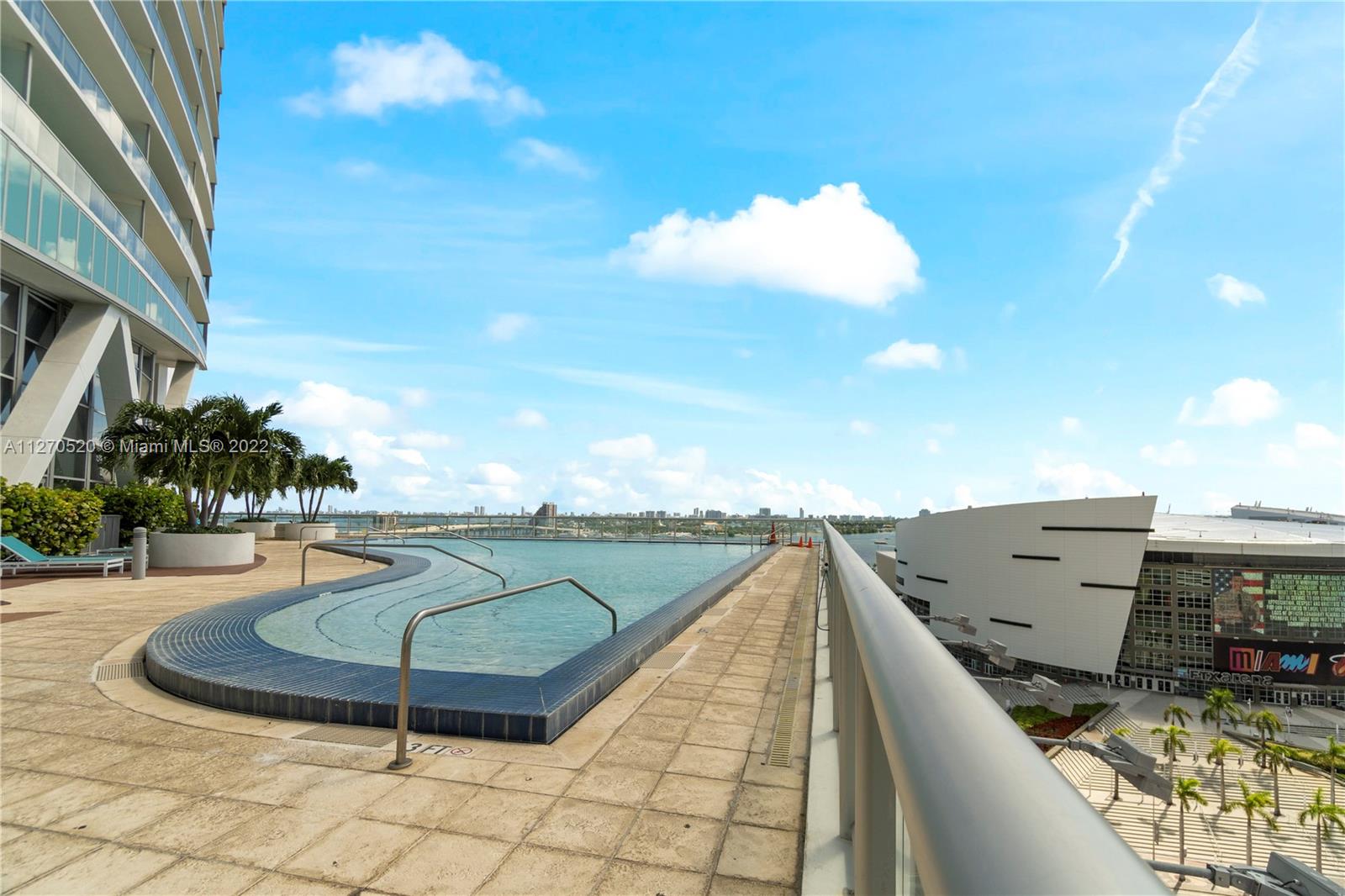 888 Biscayne Boulevard, Unit 3301 Miami, FL 33132 - Photo 19 of 29 a view of a swimming pool with seating space