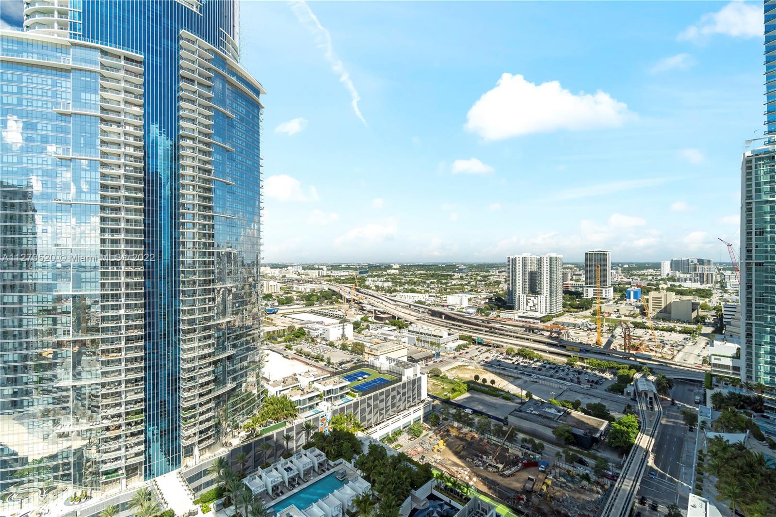 888 Biscayne Boulevard, Unit 3301 Miami, FL 33132 - Photo 22 of 29 a view of a city with tall buildings