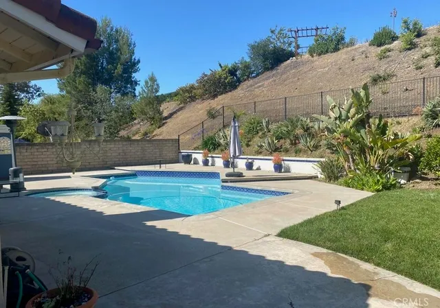 a view of a swimming pool with a patio