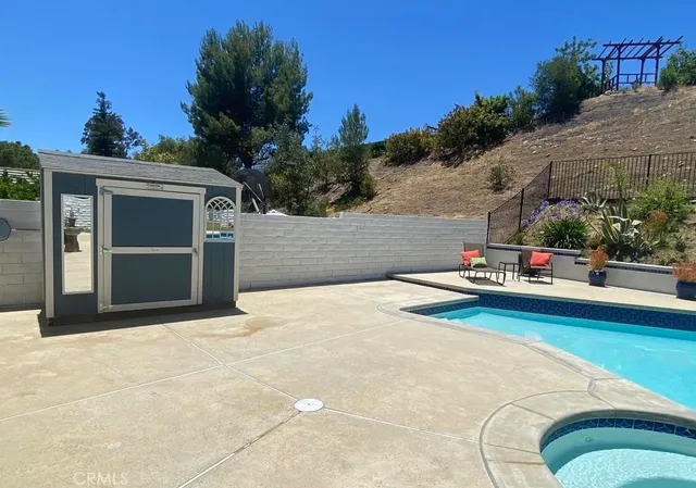 a view of a house with potted plants