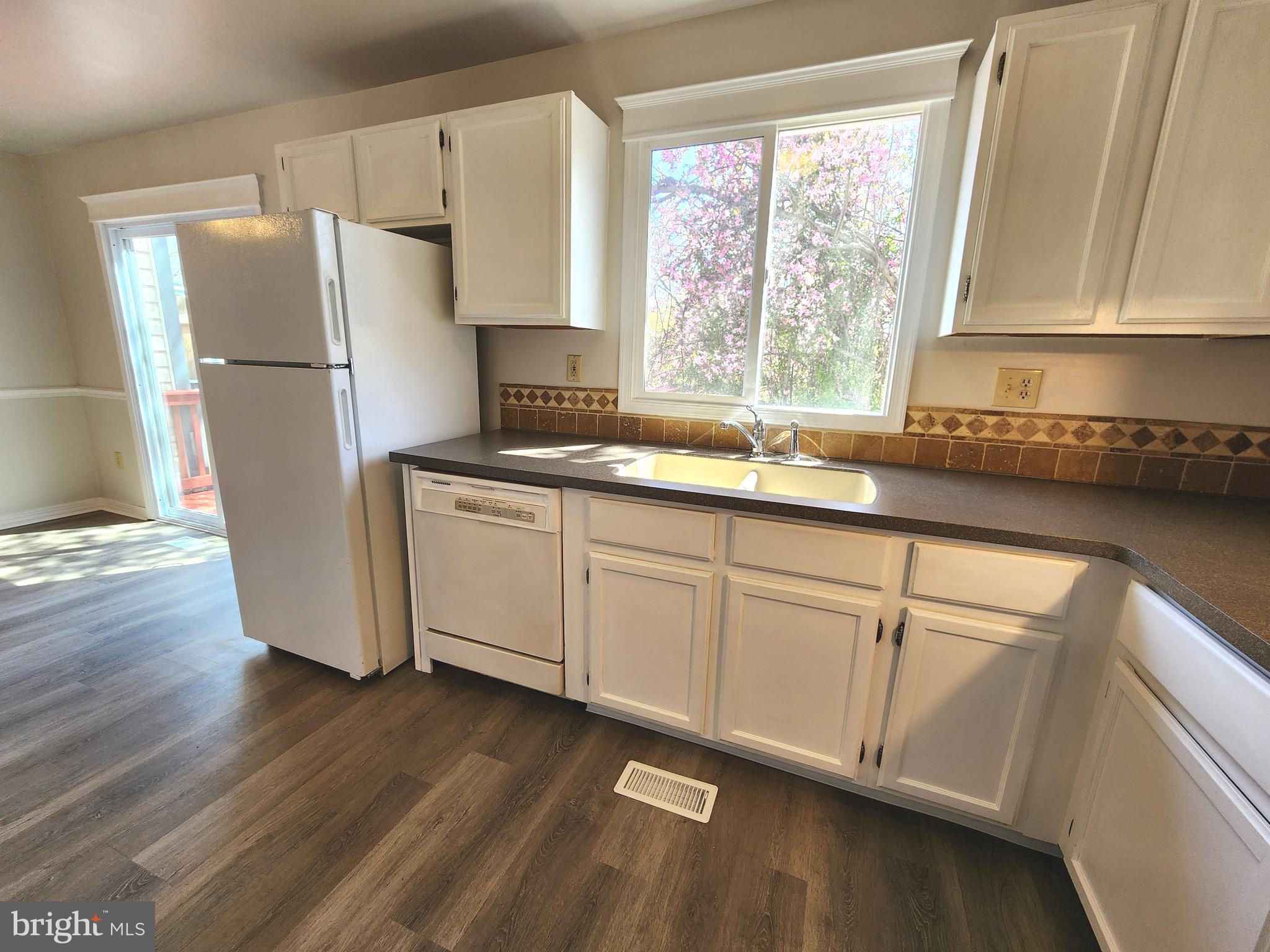 655 Knightsbridge Drive Hagerstown, MD 21740 - Photo 11 of 32 a kitchen with a refrigerator a sink and a window
