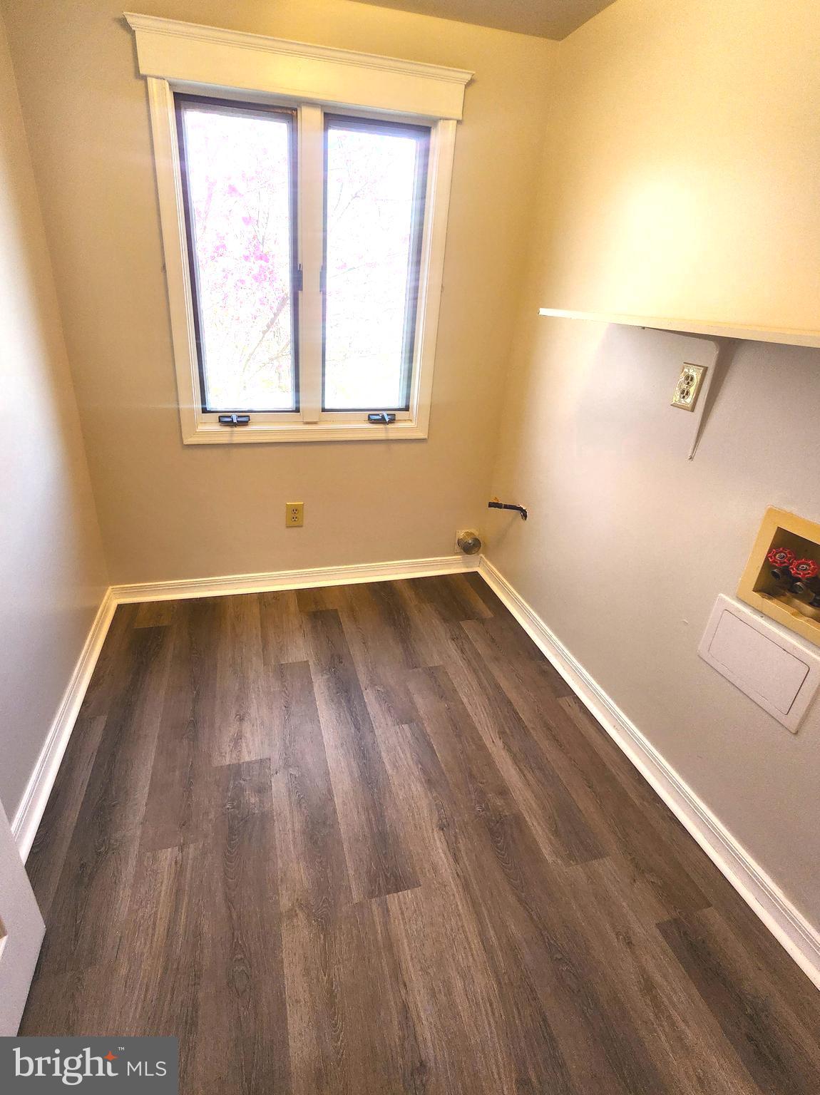 655 Knightsbridge Drive Hagerstown, MD 21740 - Photo 13 of 32 an empty room with wooden floor and windows