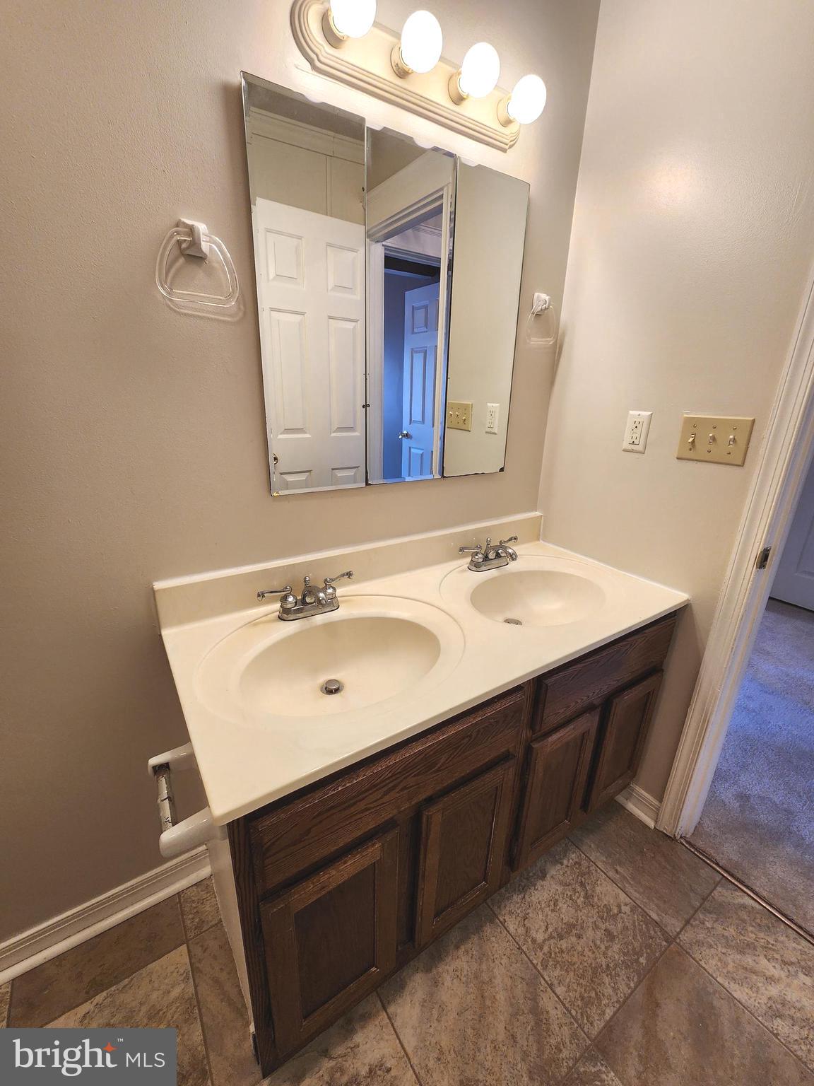 655 Knightsbridge Drive Hagerstown, MD 21740 - Photo 27 of 32 a bathroom with a sink double vanity and a mirror