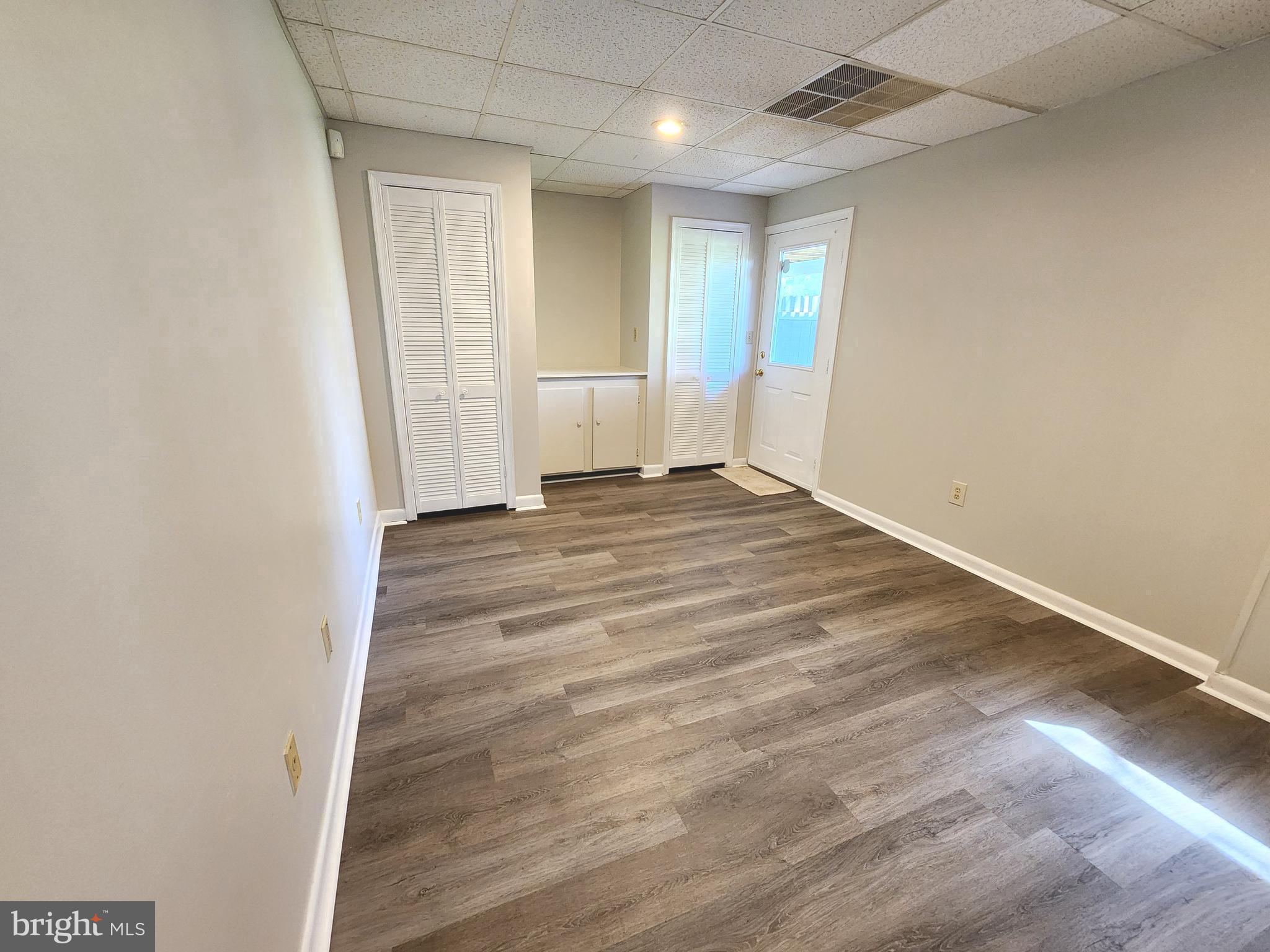 655 Knightsbridge Drive Hagerstown, MD 21740 - Photo 28 of 32 an empty room with wooden floor and windows