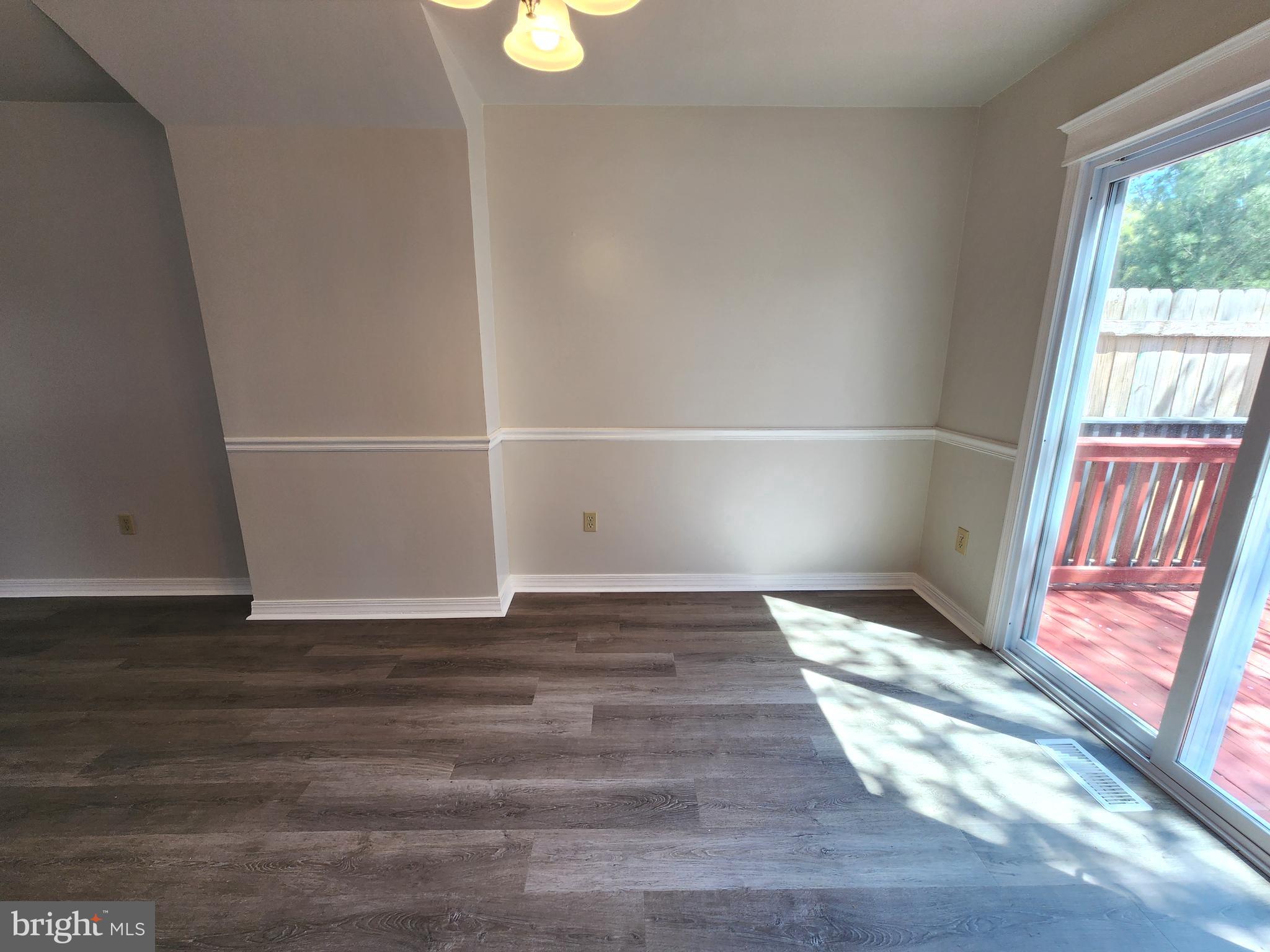 655 Knightsbridge Drive Hagerstown, MD 21740 - Photo 8 of 32 a view of an empty room with wooden floor and a window