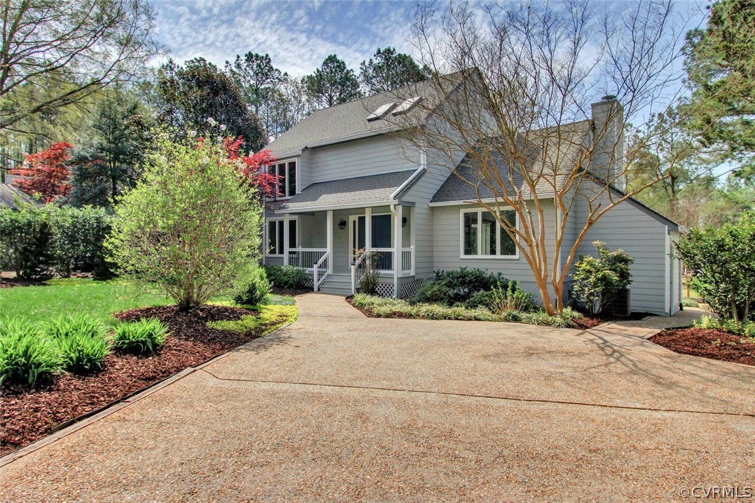 14205 Regatta Pointe Road Midlothian, VA 23112 - Photo 2 of 20 a front view of a house with a yard and potted plants