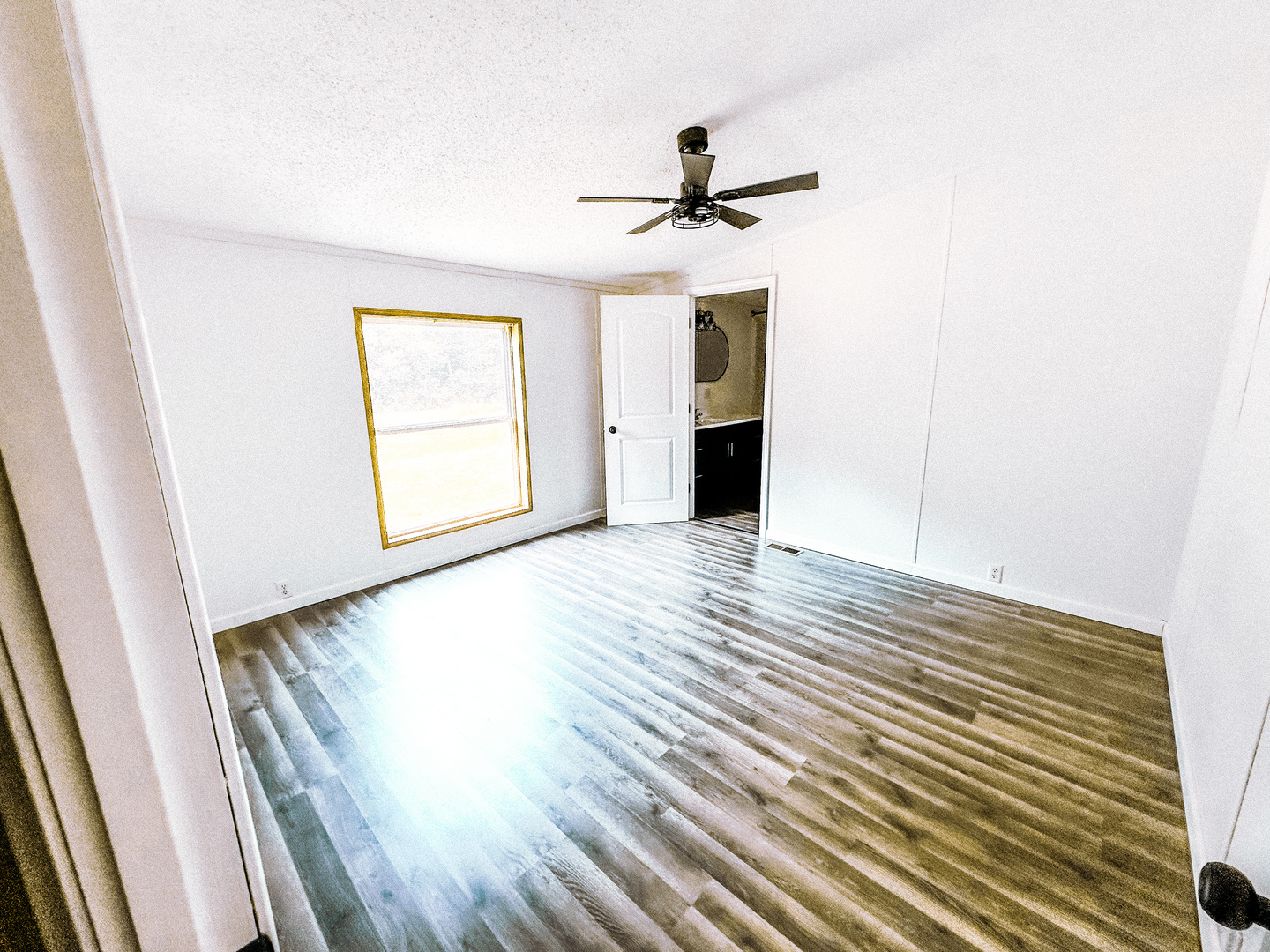4920 Mt Moriah Road Galatia, IL 62935 - Photo 30 of 33 a view of empty room with wooden floor and fan