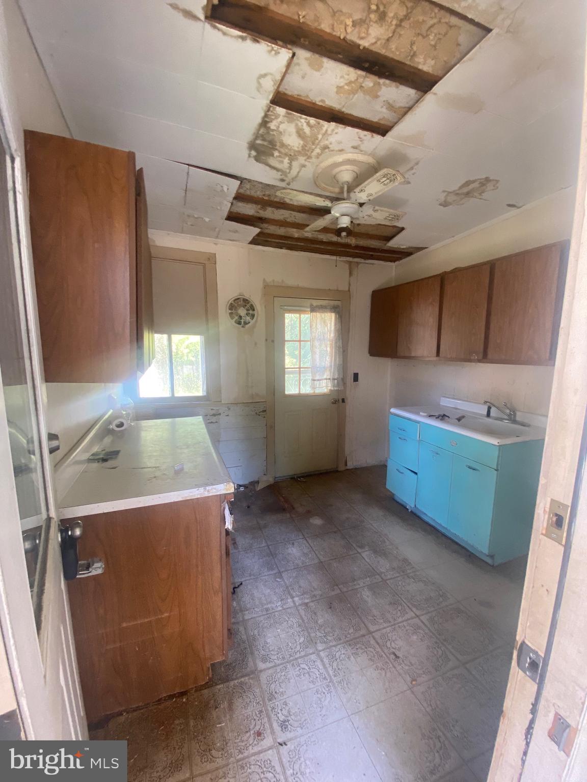 6704 Chestnut Street Port Norris, NJ 08349 - Photo 13 of 44 a view of a kitchen with a sink a washer and dryer